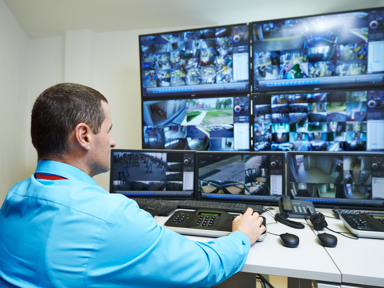 Security guard monitoring cctv